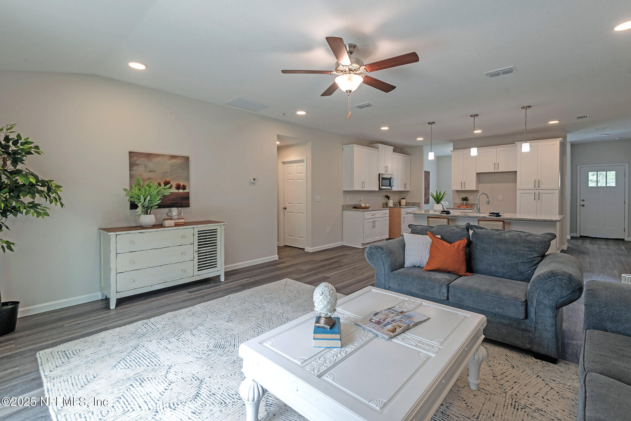 10286 Cisco Drive Jacksonville, FL 32219 - Photo 21 of 45 a living room with furniture and kitchen view