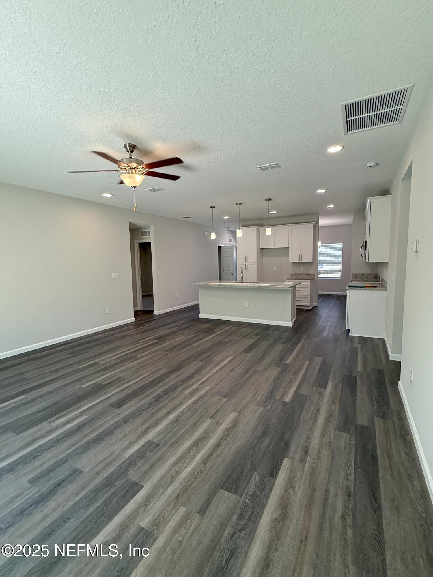 10286 Cisco Drive Jacksonville, FL 32219 - Photo 45 of 45 a view of kitchen with cabinets and wooden floor