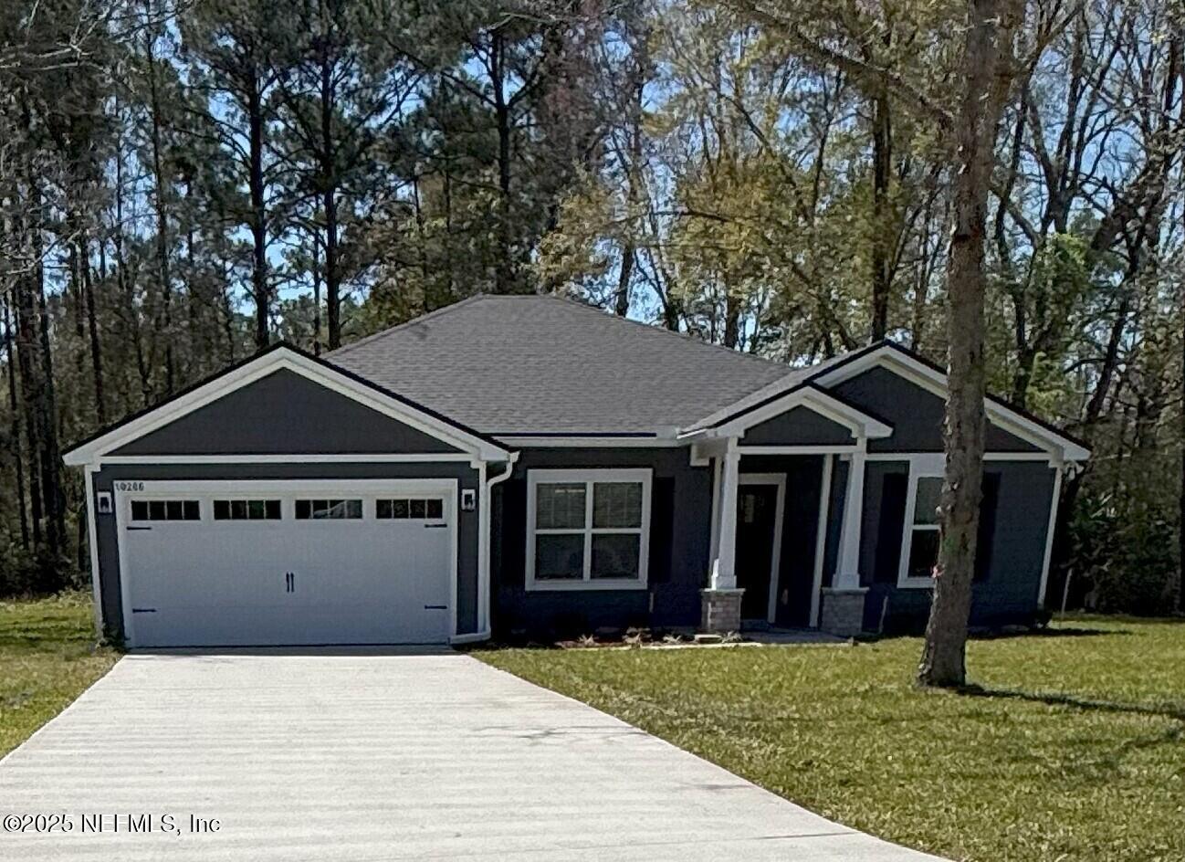 10286 Cisco Drive Jacksonville, FL 32219 - Photo 44 of 45 a front view of a house with a yard