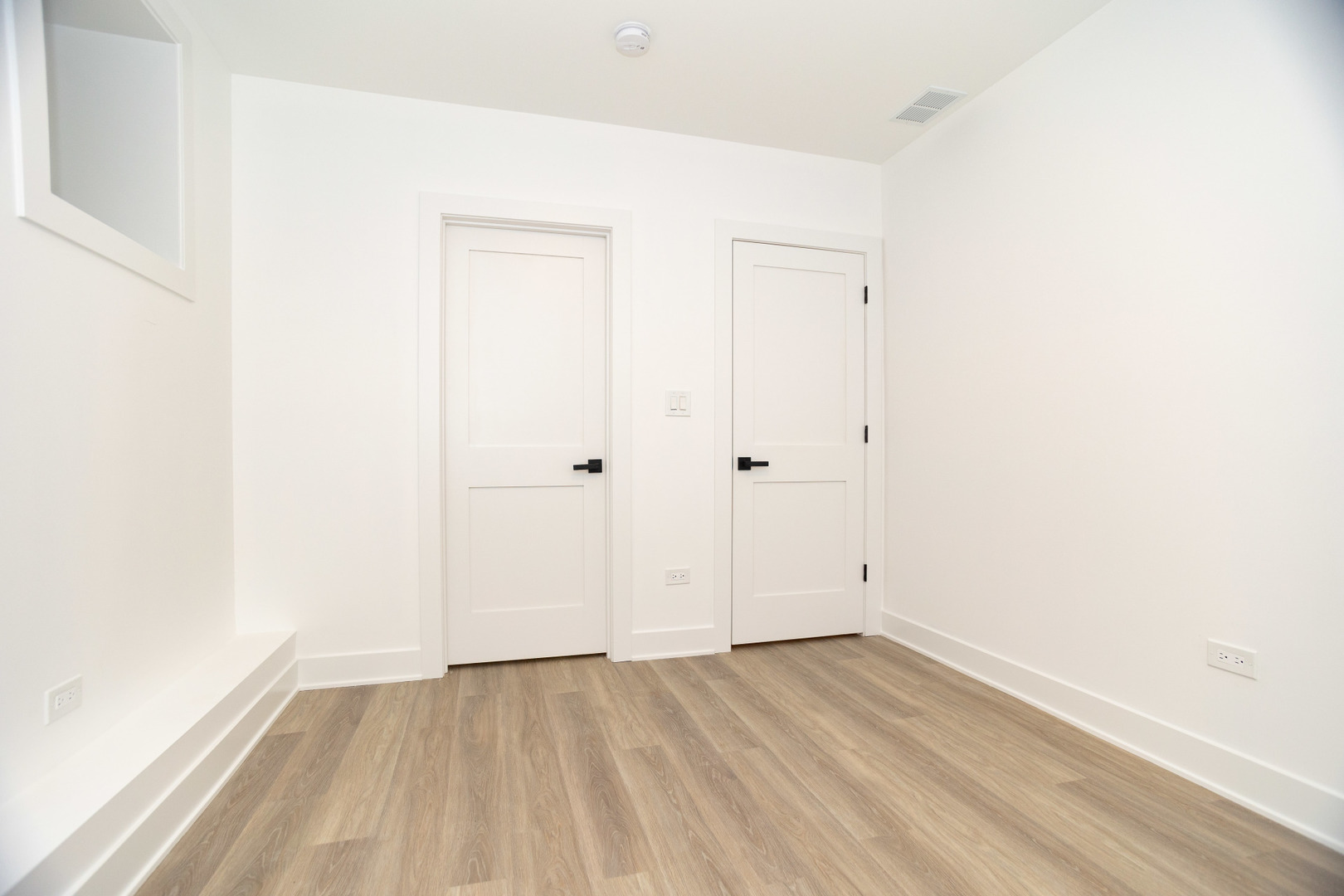 1723 West Pierce Avenue, Unit 1 Chicago, IL 60622 - Photo 20 of 24 an empty room with wooden floor