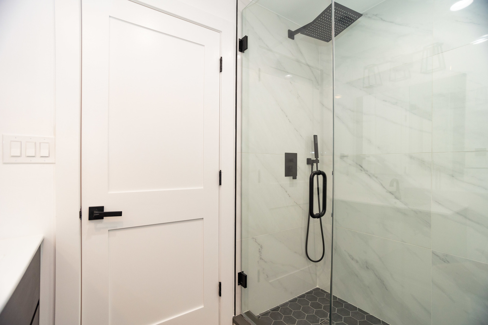 1723 West Pierce Avenue, Unit 1 Chicago, IL 60622 - Photo 22 of 24 a bathroom with a glass shower door