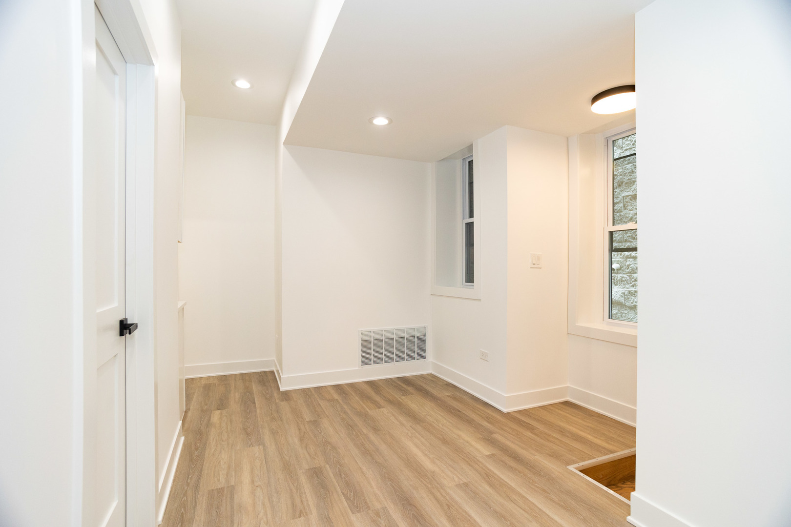 1723 West Pierce Avenue, Unit 1 Chicago, IL 60622 - Photo 6 of 24 a view of empty room with wooden floor and fan