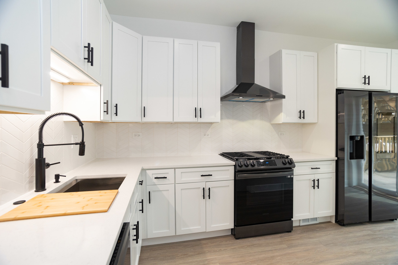 1723 West Pierce Avenue, Unit 1 Chicago, IL 60622 - Photo 7 of 24 a kitchen with stainless steel appliances granite countertop a stove and a refrigerator