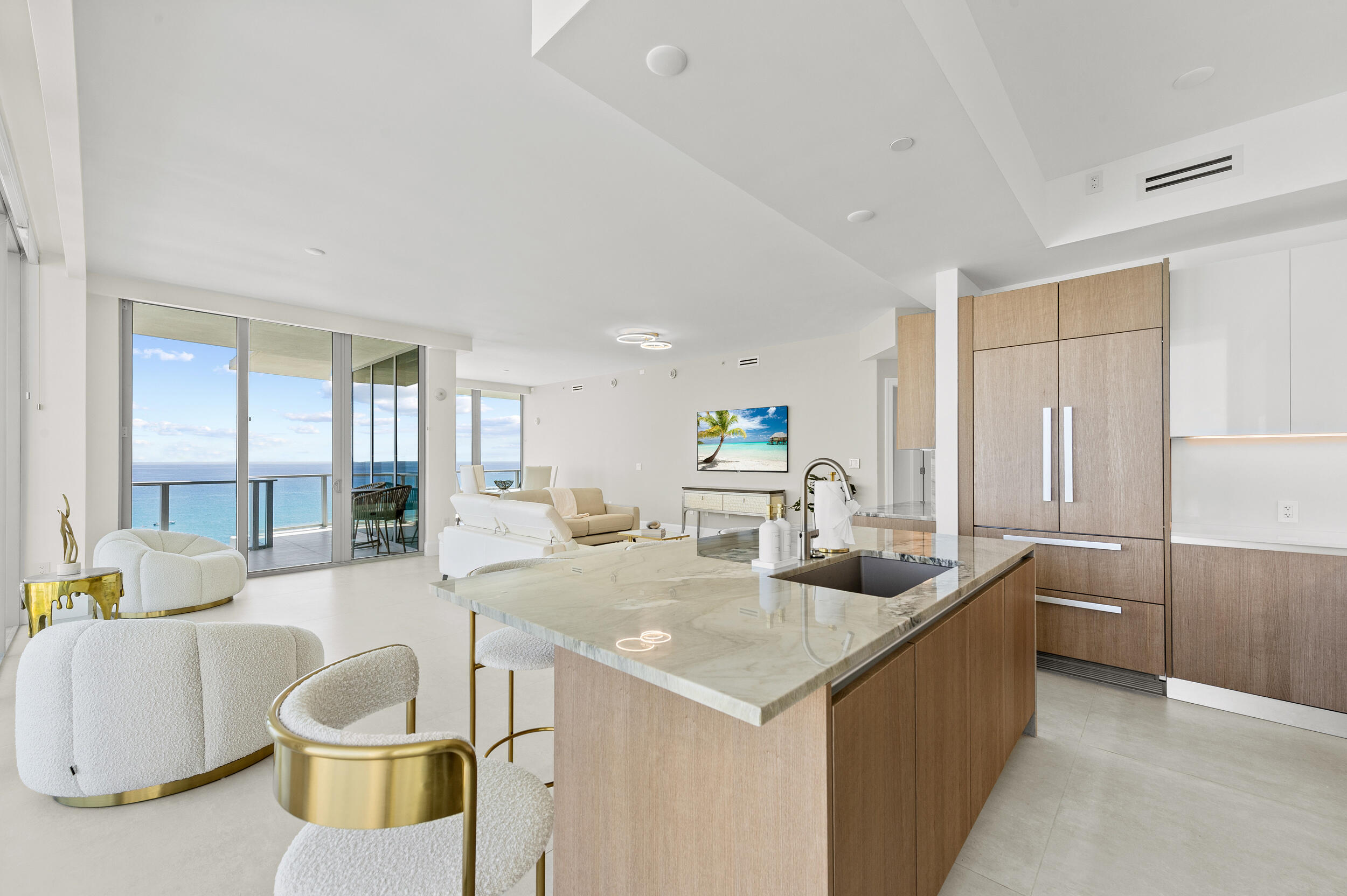 3100 North Ocean Drive, Unit 1103H Riviera Beach, FL 33404 - Photo 15 of 50 a living room with kitchen island furniture and a wooden floor