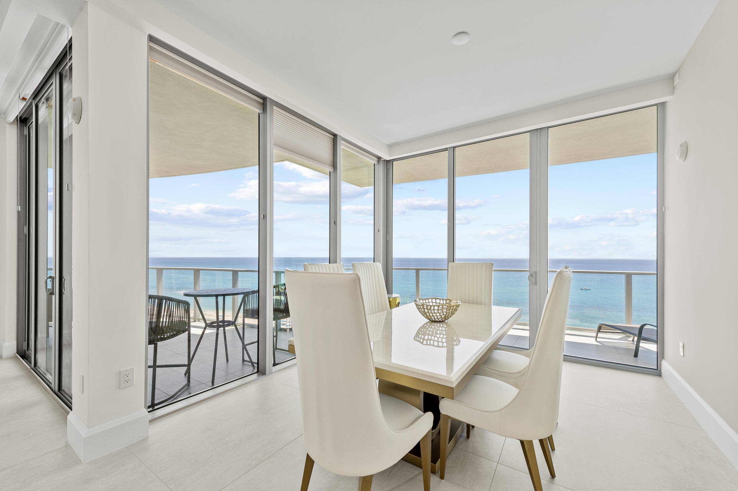 3100 North Ocean Drive, Unit 1103H Riviera Beach, FL 33404 - Photo 17 of 50 a view of a livingroom with furniture and floor to ceiling window