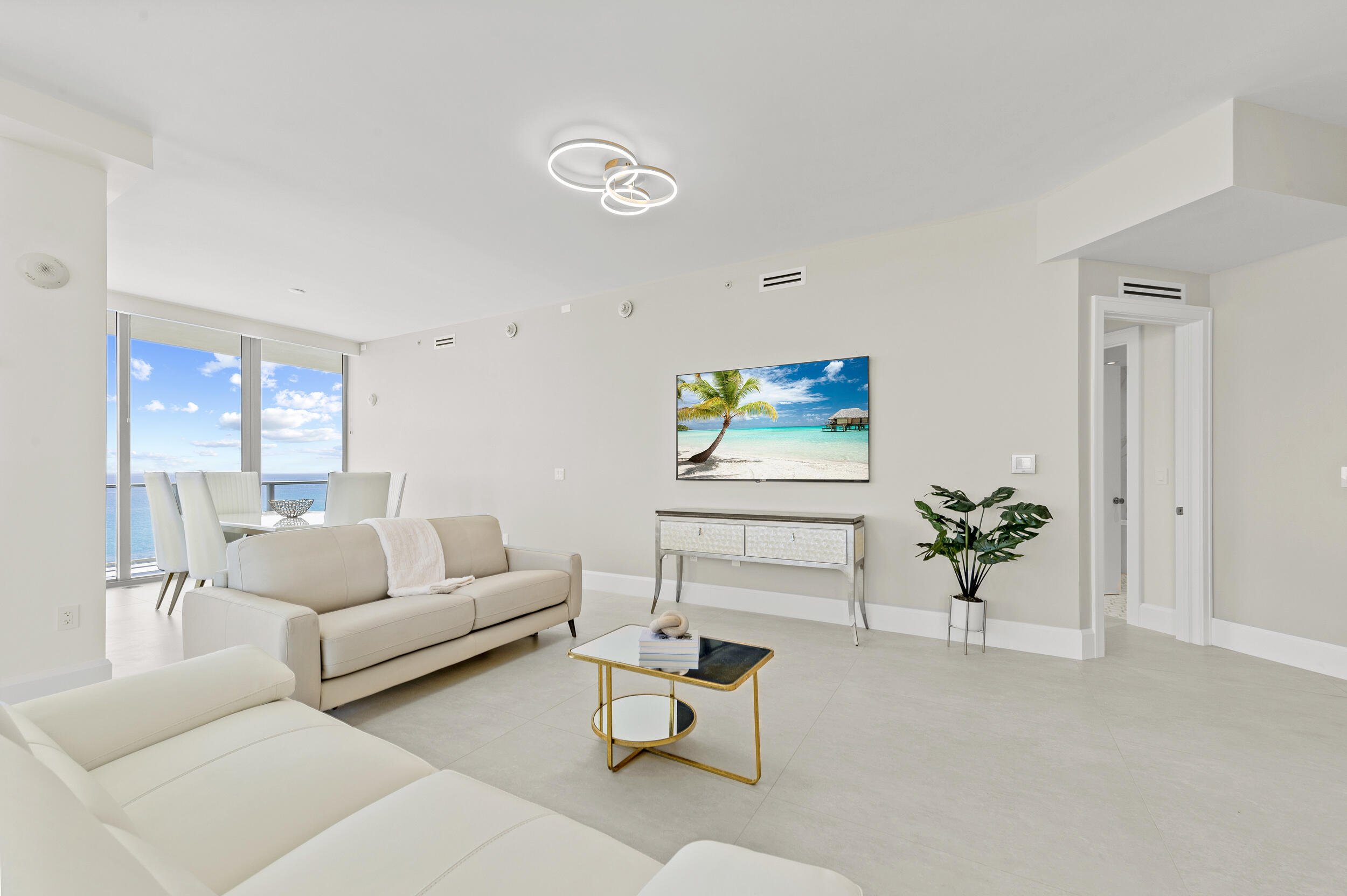 3100 North Ocean Drive, Unit 1103H Riviera Beach, FL 33404 - Photo 2 of 50 a living room with furniture and wooden floor