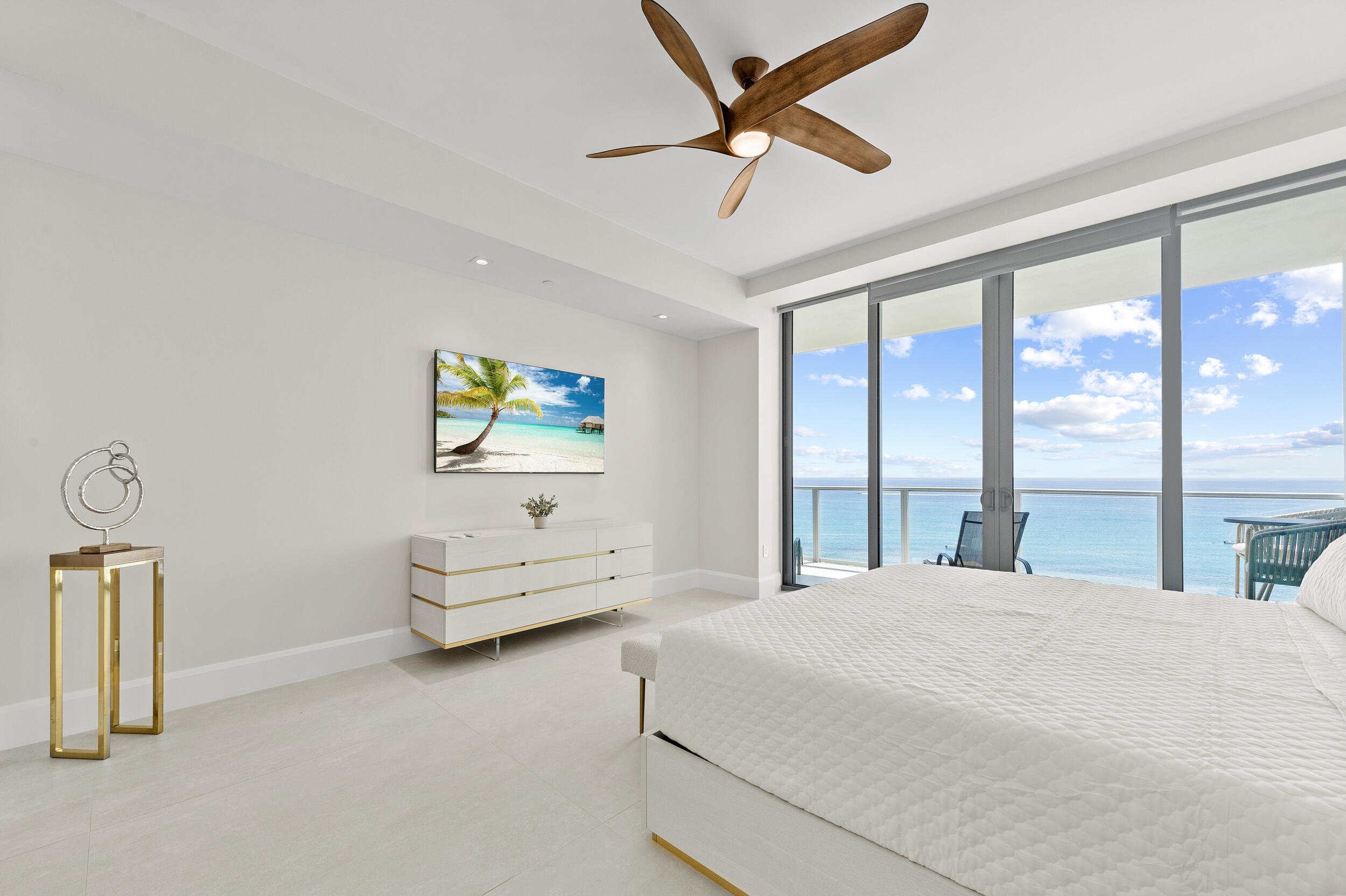 3100 North Ocean Drive, Unit 1103H Riviera Beach, FL 33404 - Photo 23 of 50 a bedroom with a bed couch and window