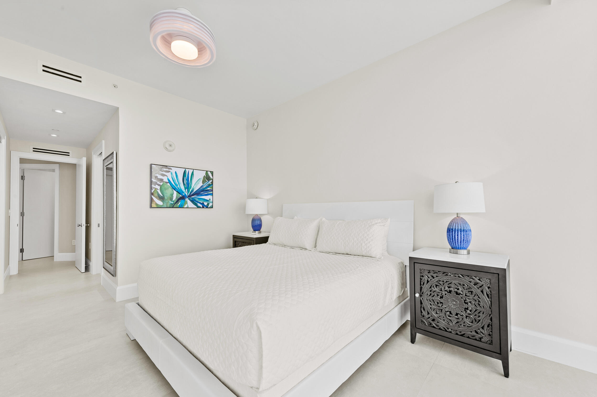 3100 North Ocean Drive, Unit 1103H Riviera Beach, FL 33404 - Photo 29 of 50 a bedroom with a bed and a couch