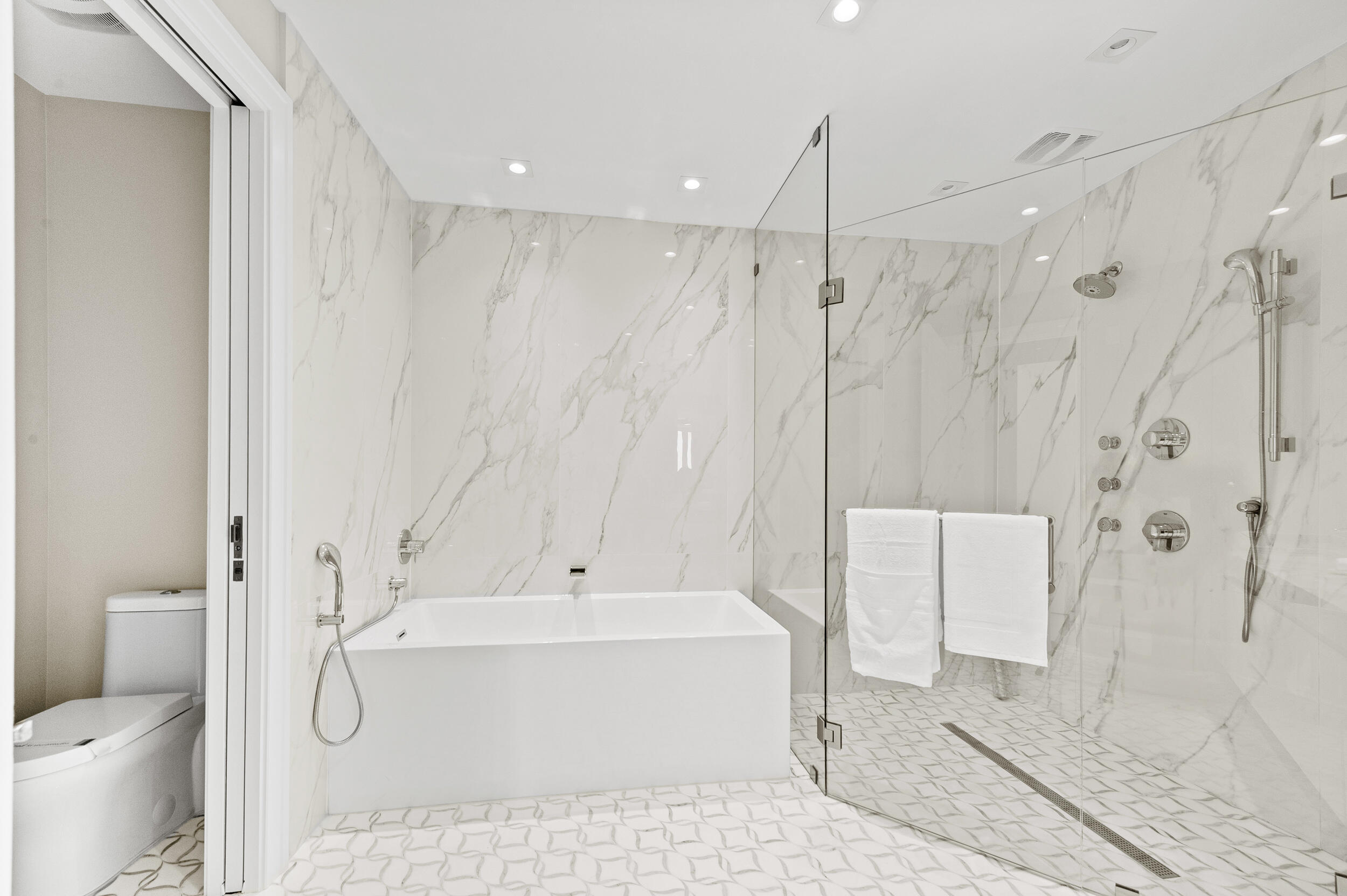 3100 North Ocean Drive, Unit 1103H Riviera Beach, FL 33404 - Photo 31 of 50 a bathroom with a white toilet and shower