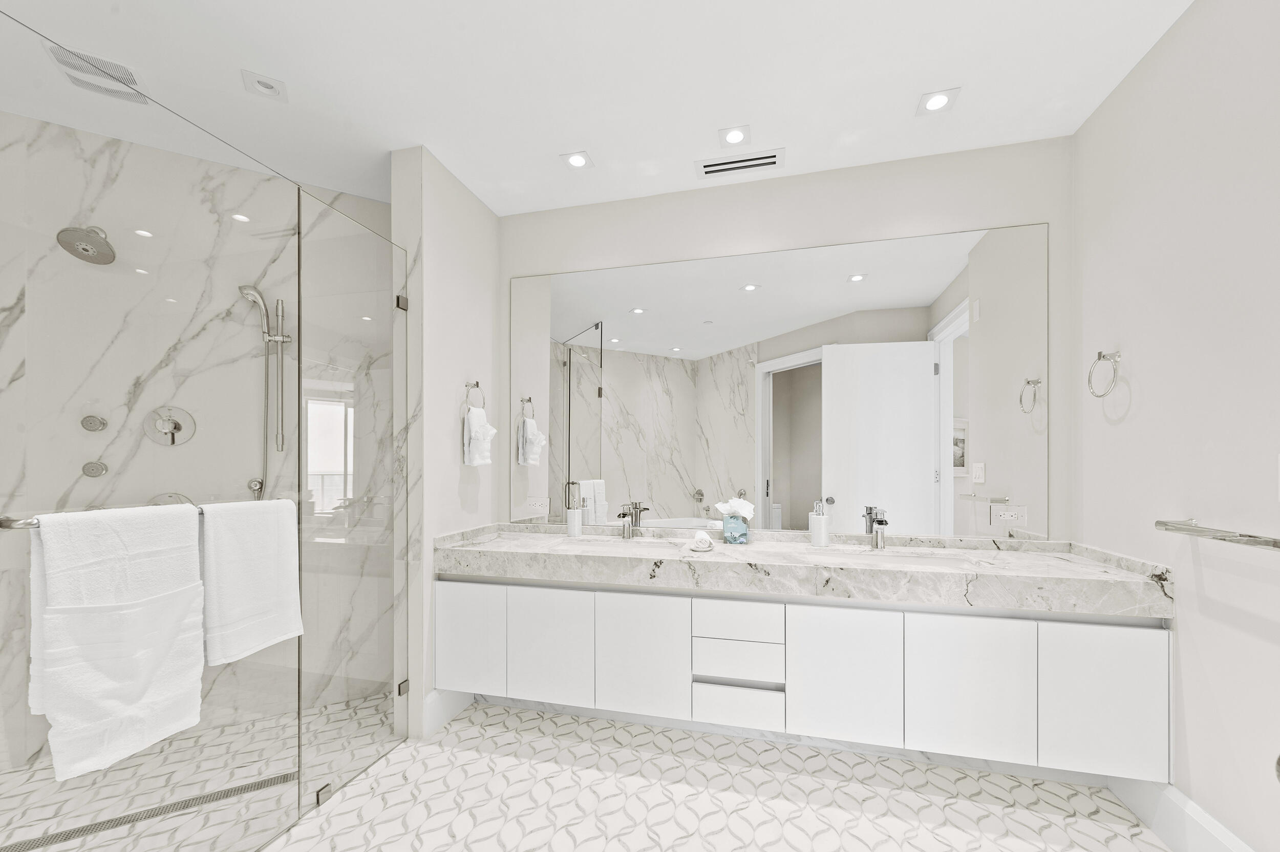 3100 North Ocean Drive, Unit 1103H Riviera Beach, FL 33404 - Photo 32 of 50 a bathroom with a double vanity sink mirror and double