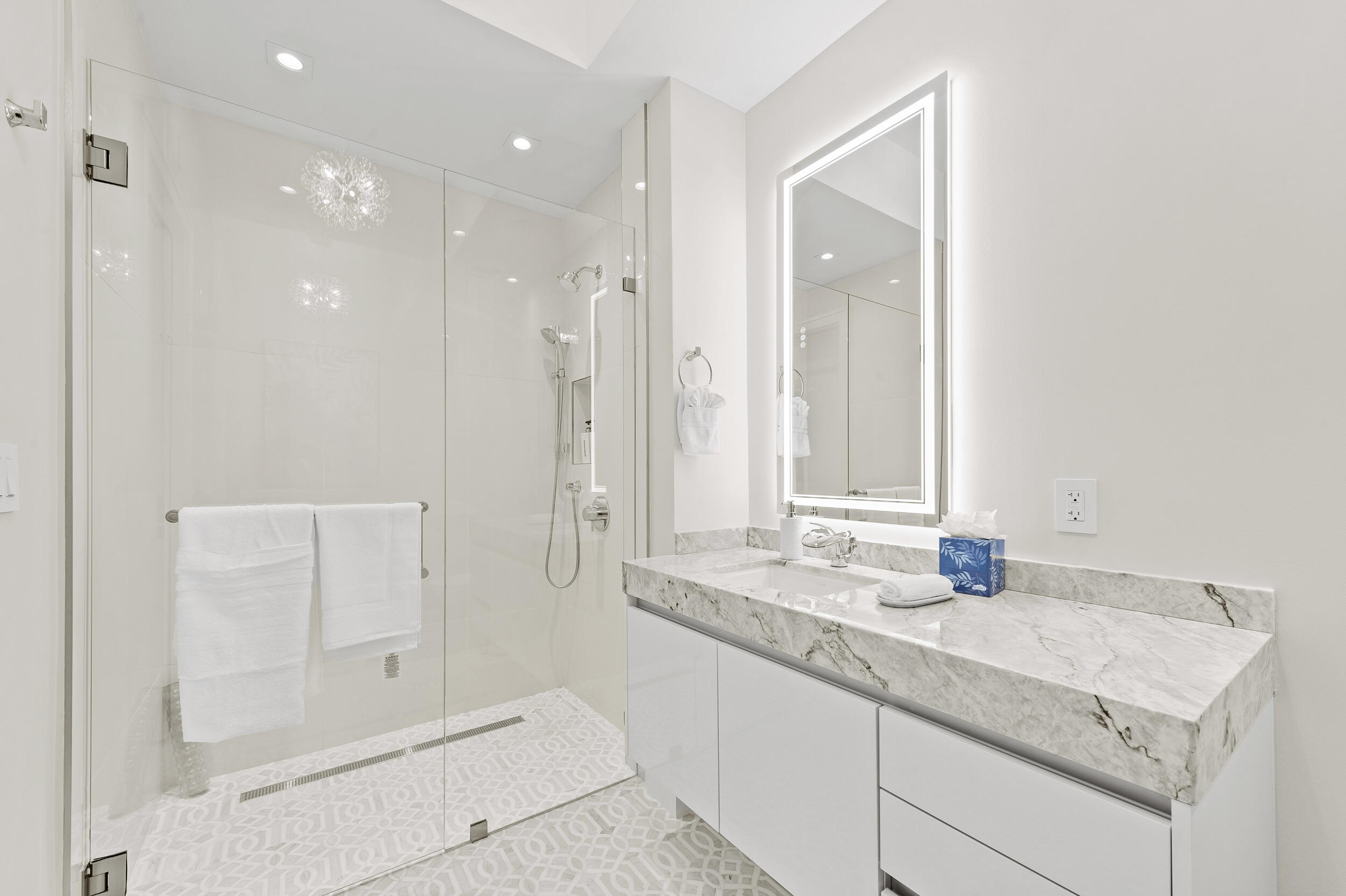 3100 North Ocean Drive, Unit 1103H Riviera Beach, FL 33404 - Photo 34 of 50 a bathroom with a granite countertop sink mirror and double