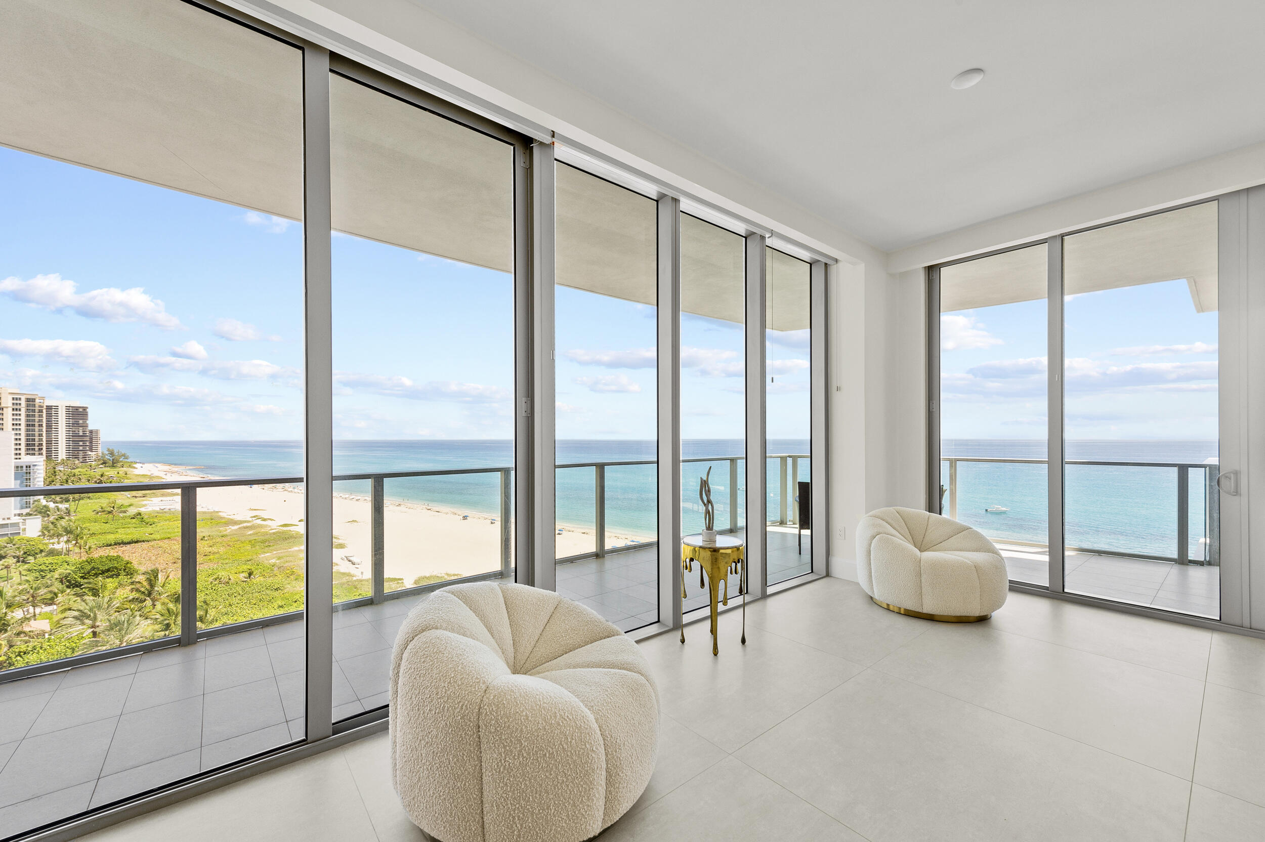 3100 North Ocean Drive, Unit 1103H Riviera Beach, FL 33404 - Photo 4 of 50 a living room with couch and floor to ceiling window