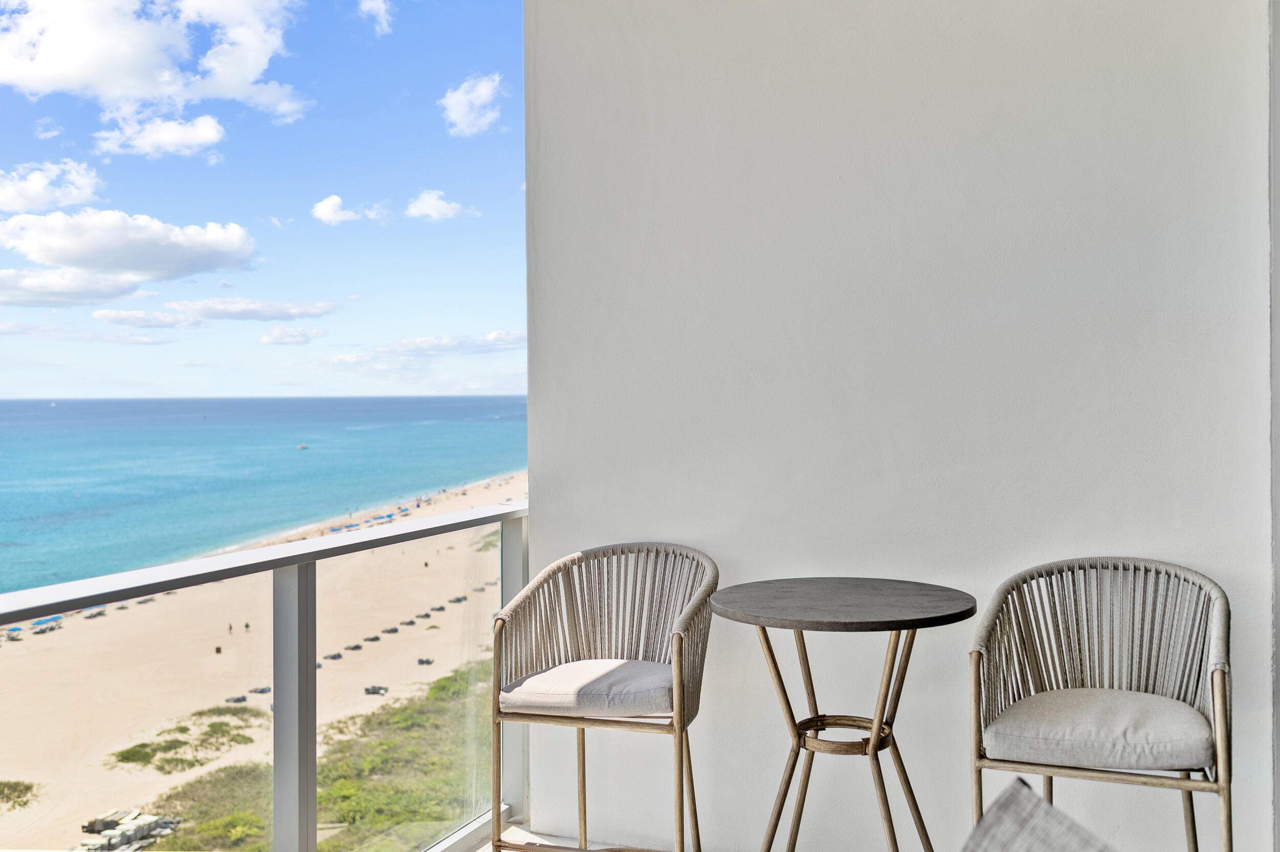 3100 North Ocean Drive, Unit 1103H Riviera Beach, FL 33404 - Photo 46 of 50 a view of a balcony with chairs