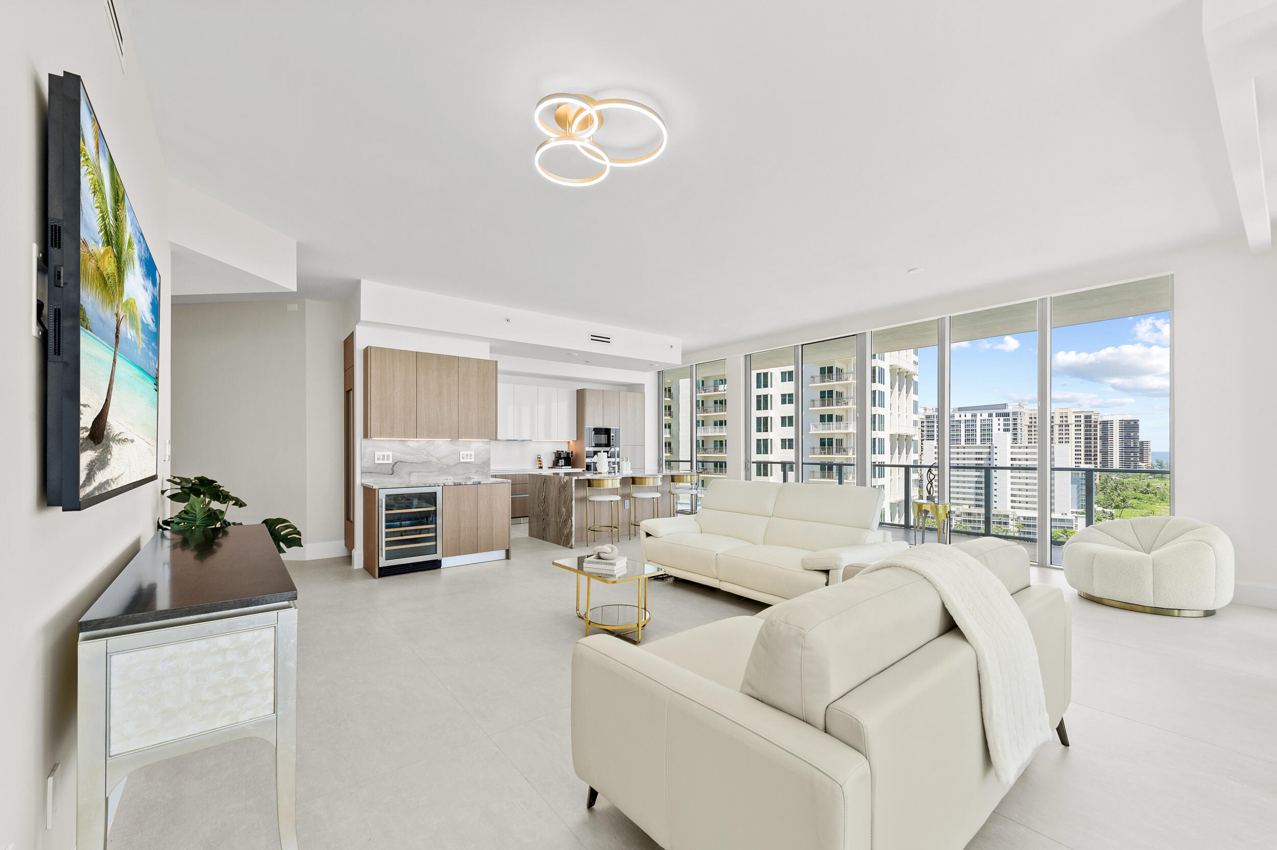 3100 North Ocean Drive, Unit 1103H Riviera Beach, FL 33404 - Photo 7 of 50 a living room with furniture fireplace and a large window