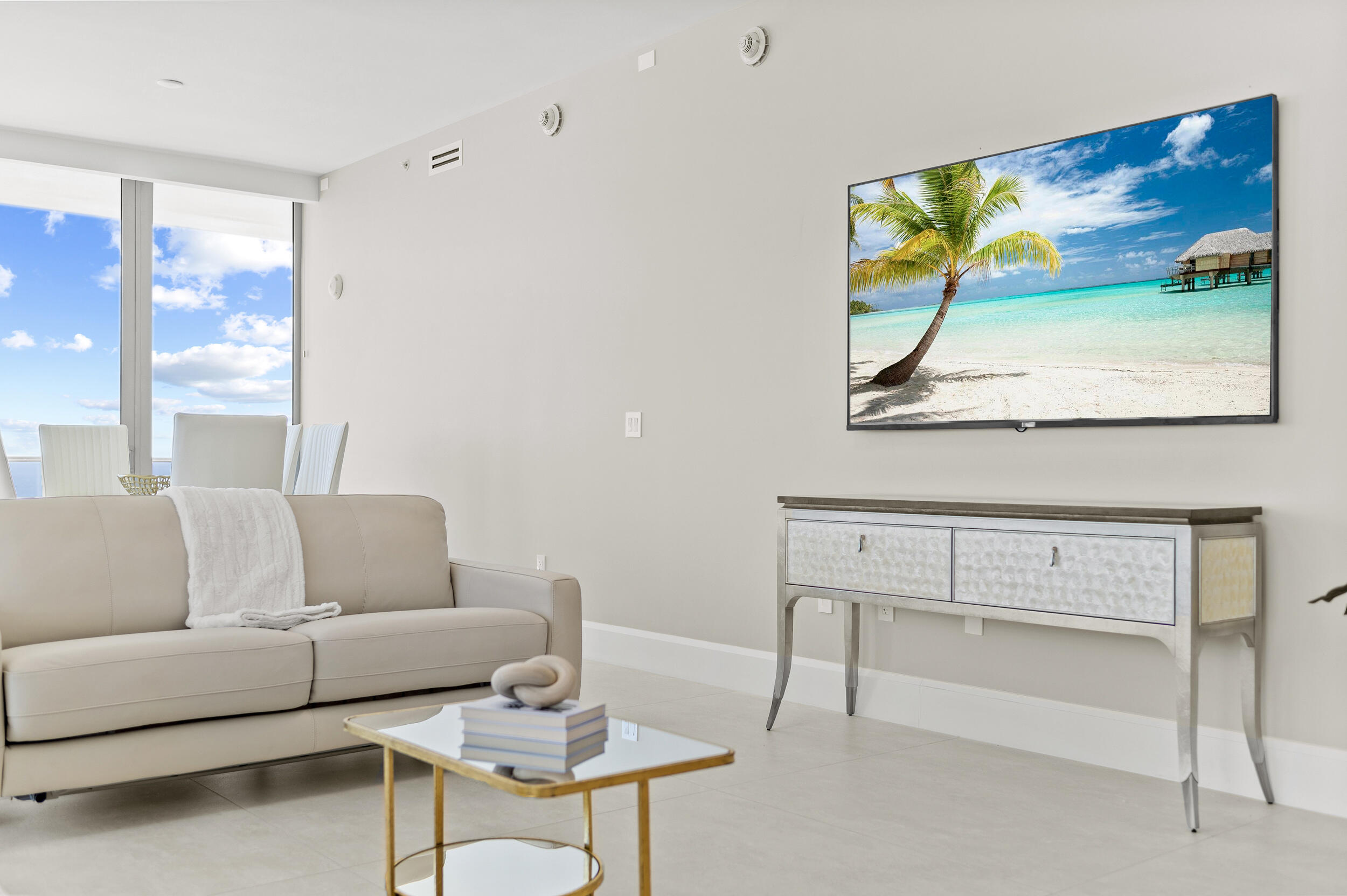 3100 North Ocean Drive, Unit 1103H Riviera Beach, FL 33404 - Photo 8 of 50 a living room with furniture and a flat screen tv