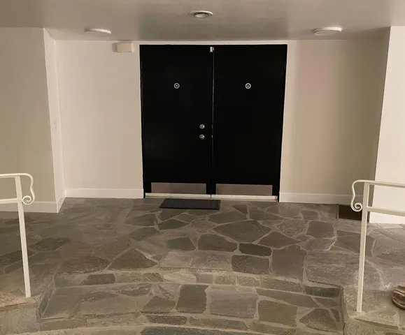 a table with a vase and flowers on it