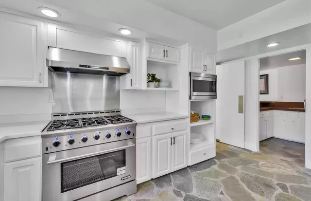 a outdoor space with patio furniture and garden view