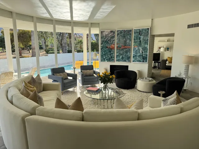 a spacious bathroom with double vanity sink and a tub