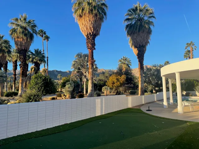 a spacious bedroom with a bed and a walk in closet