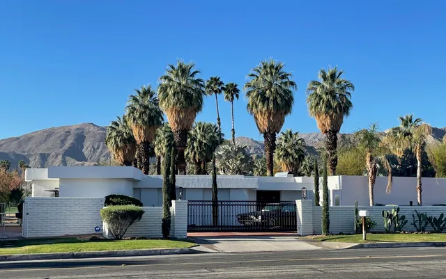 a view of a house with a street