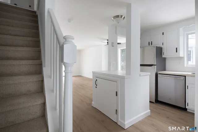 a view of a kitchen from the hallway