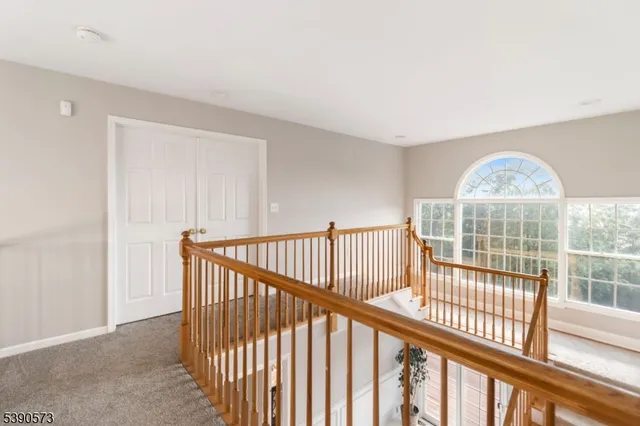a view of staircase with wooden floor