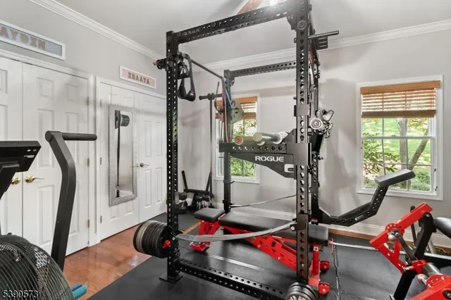 a room with gym equipment and a mirror