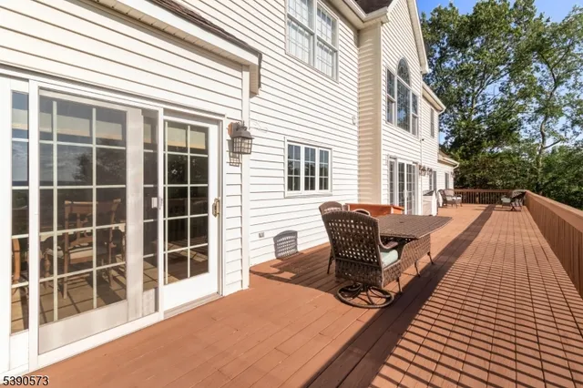 a balcony view with a seating space