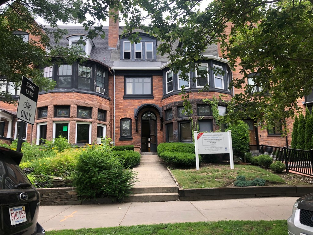 a front view of a building with garden
