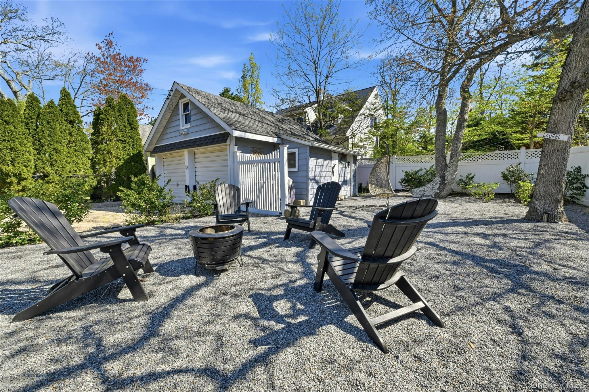 46 Beach Road Laurel, NY 11948 - Photo 16 of 24 a view of a backyard with sitting area