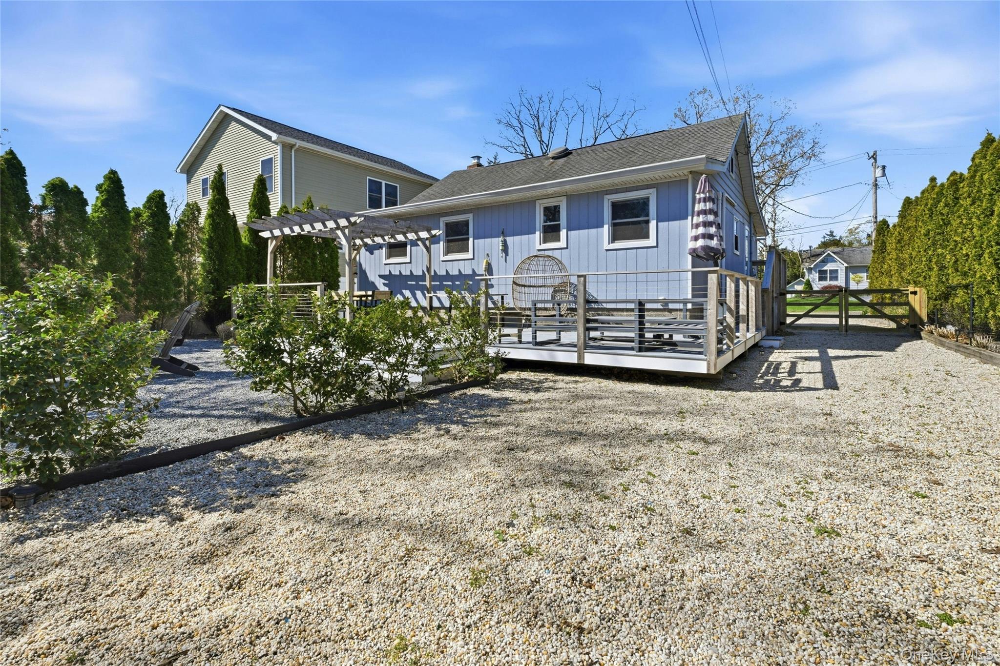 46 Beach Road Laurel, NY 11948 - Photo 17 of 24 front view of a house with a yard