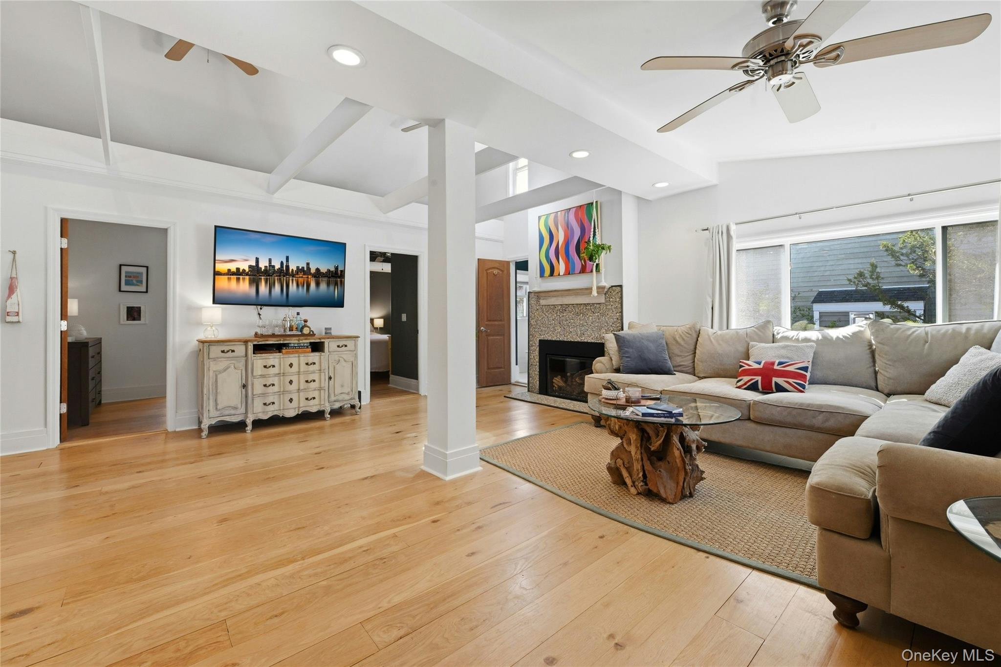 46 Beach Road Laurel, NY 11948 - Photo 2 of 24 a living room with furniture and a fireplace