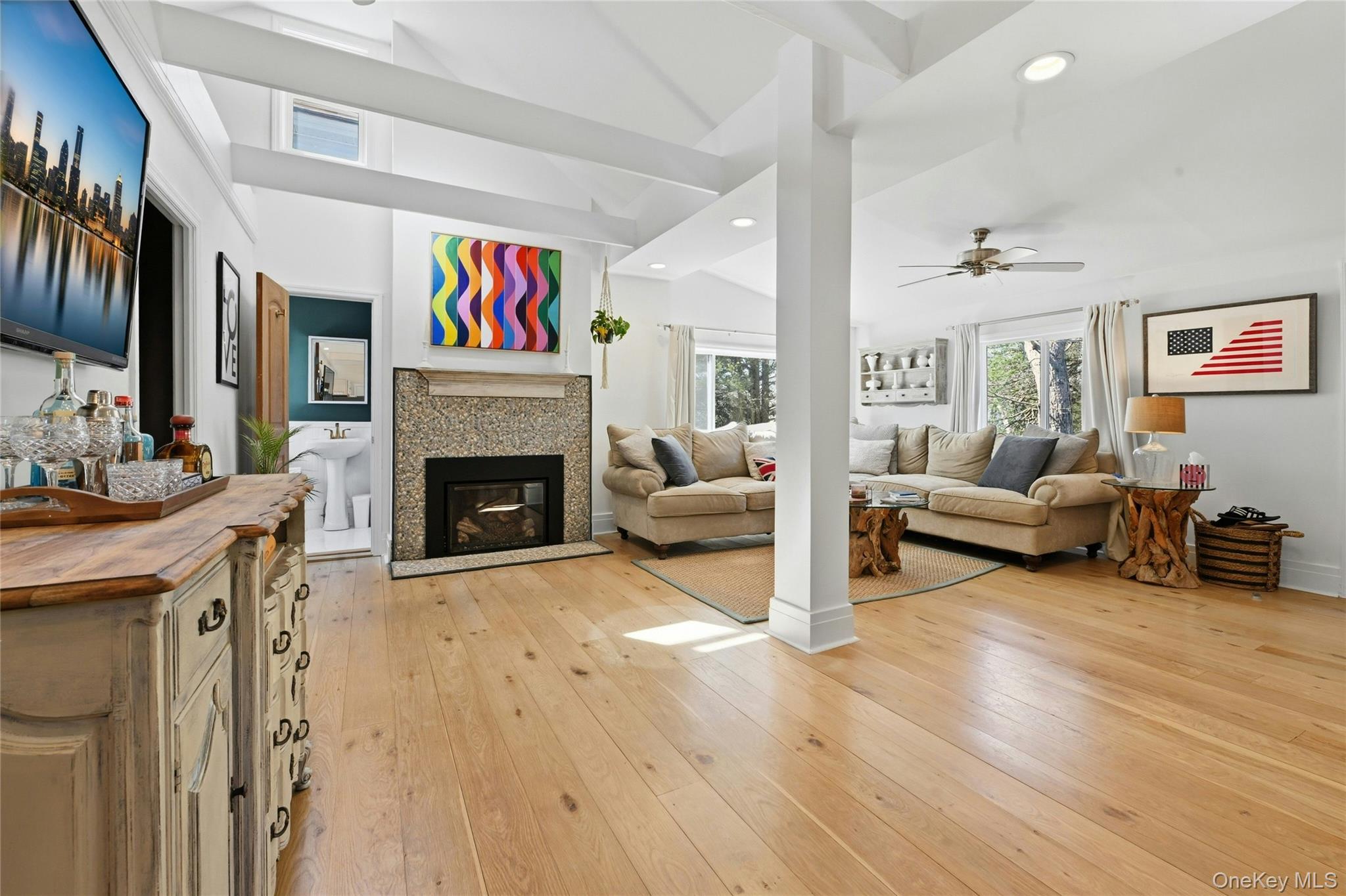 46 Beach Road Laurel, NY 11948 - Photo 3 of 24 a living room with furniture and a fireplace