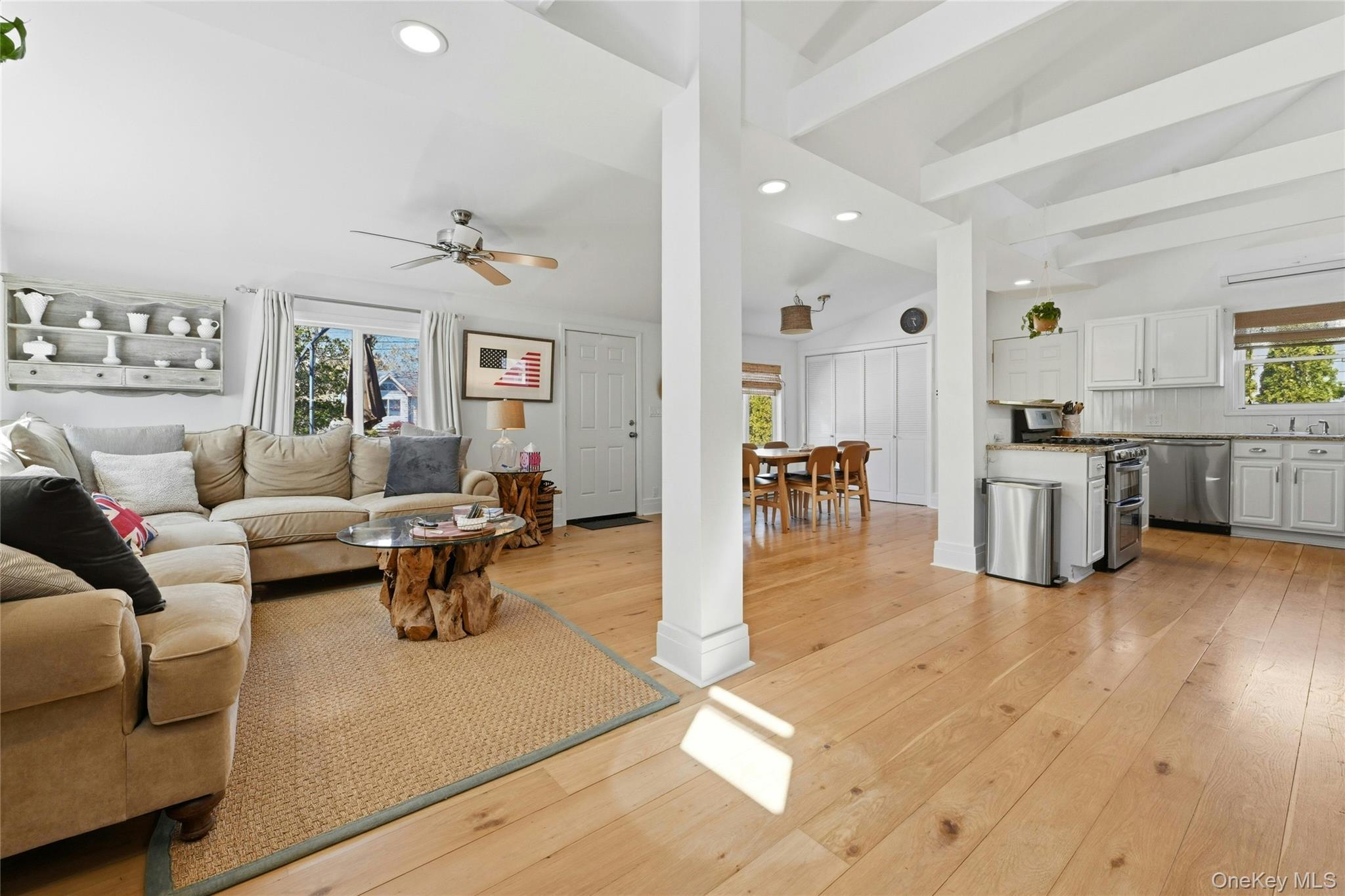 46 Beach Road Laurel, NY 11948 - Photo 4 of 24 a living room with furniture and a wooden floor