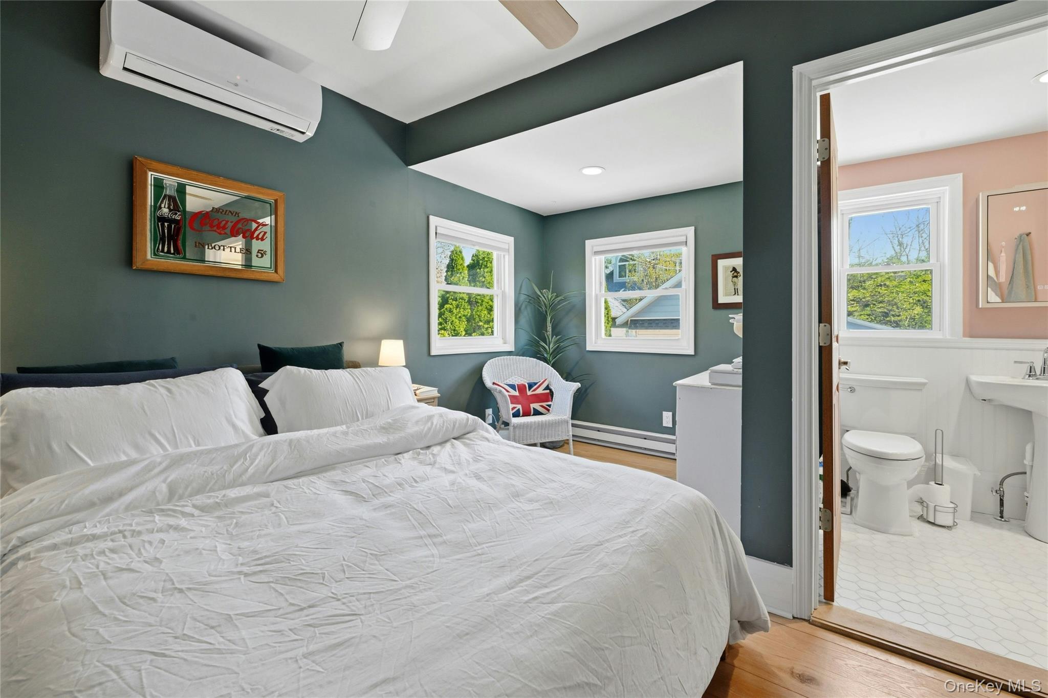 46 Beach Road Laurel, NY 11948 - Photo 9 of 24 a bedroom with a bed and a large window