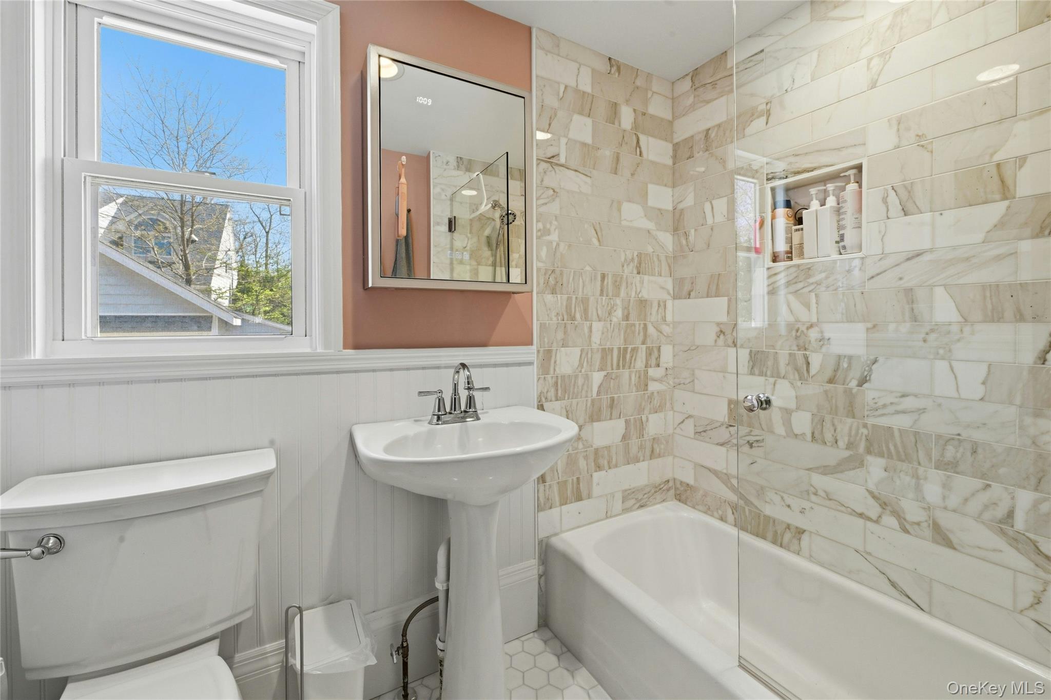 46 Beach Road Laurel, NY 11948 - Photo 10 of 24 a bathroom with a sink a toilet and shower