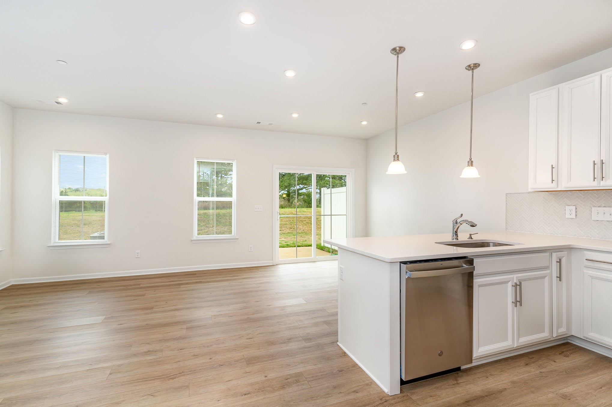 160 Keelon Gap Road Spring Hill, TN 37174 - Photo 14 of 32 a kitchen with stainless steel appliances granite countertop a sink a stove and a wooden floors