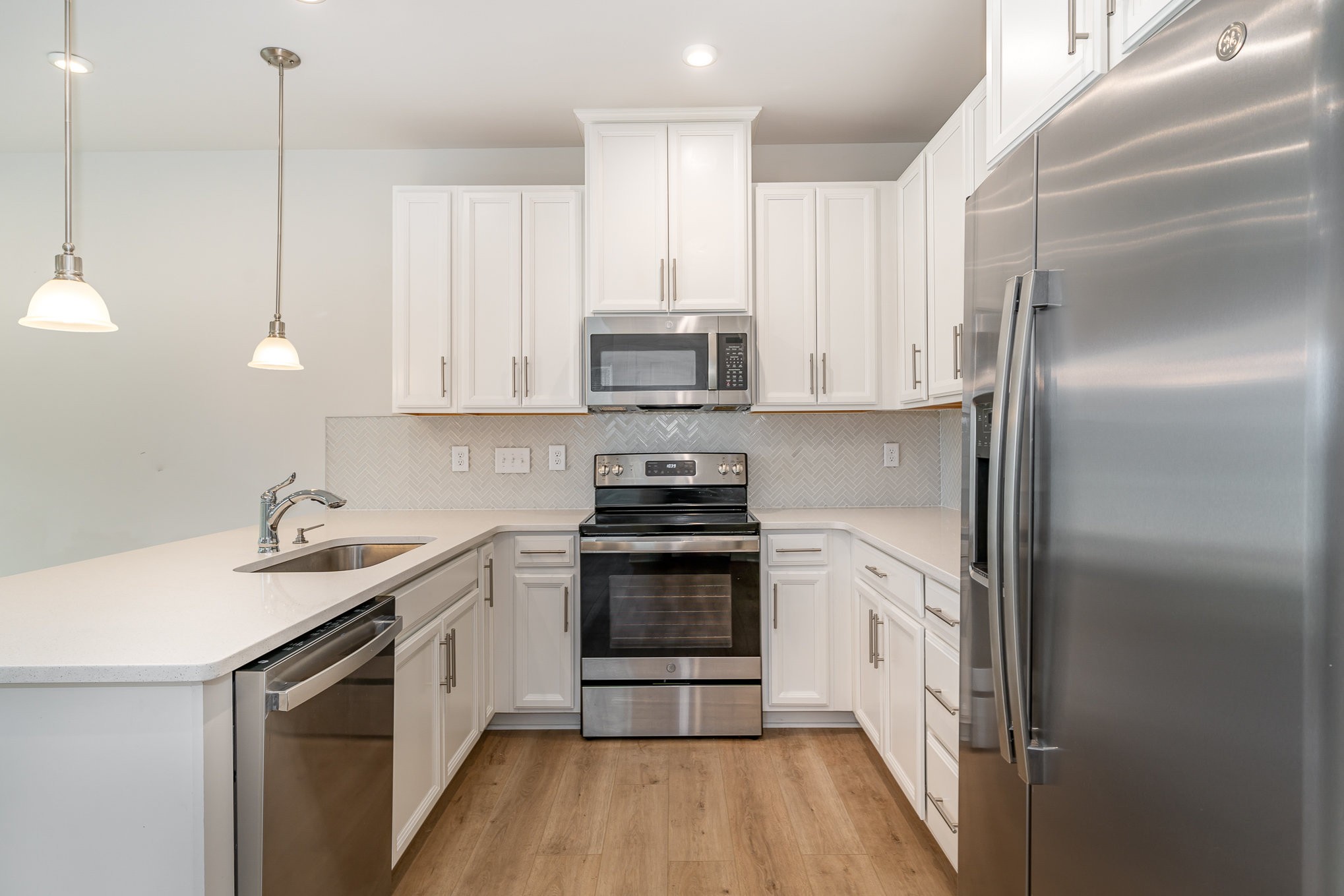 160 Keelon Gap Road Spring Hill, TN 37174 - Photo 2 of 32 a kitchen with a sink stove and refrigerator