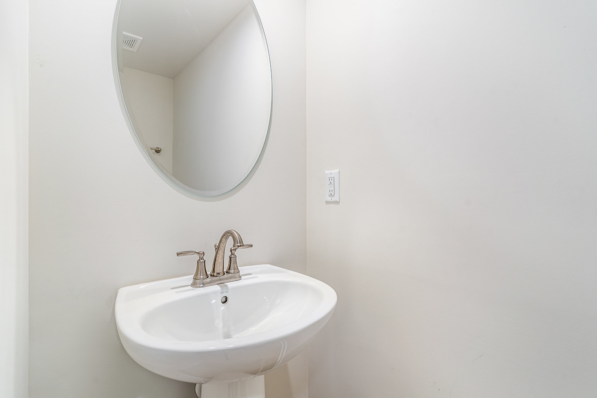 160 Keelon Gap Road Spring Hill, TN 37174 - Photo 23 of 32 a bathroom with a sink and mirror