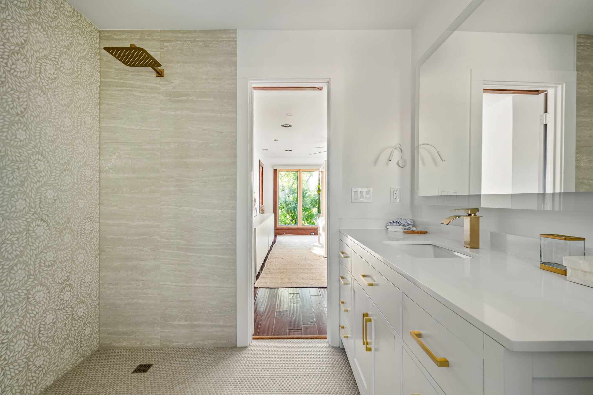 1111 West 12th Street, Unit 107 Austin, TX 78703 - Photo 30 of 38 Bathroom featuring a white vanity with gold-finish hardware, integrated sink, and a large mirror