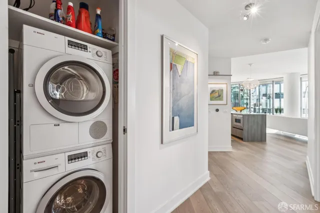 a view of a hallway with washer and dryer