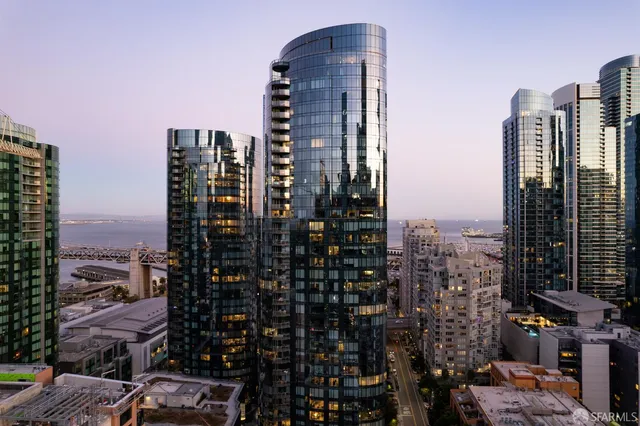 a building with glass table and chairs