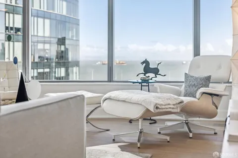 a bed room with a bed and a large window