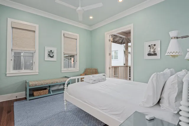 a bedroom with a bed a table and chair