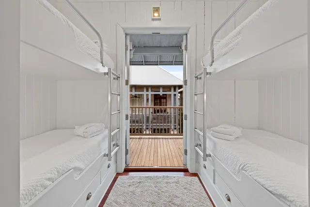 a view of a patio with couches table and chairs and potted plants