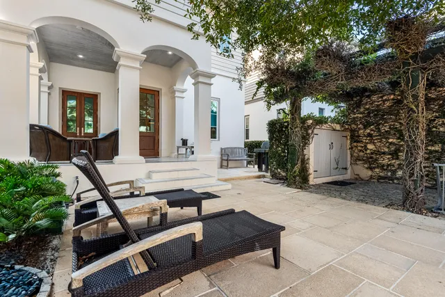 a front view of a building with a yard