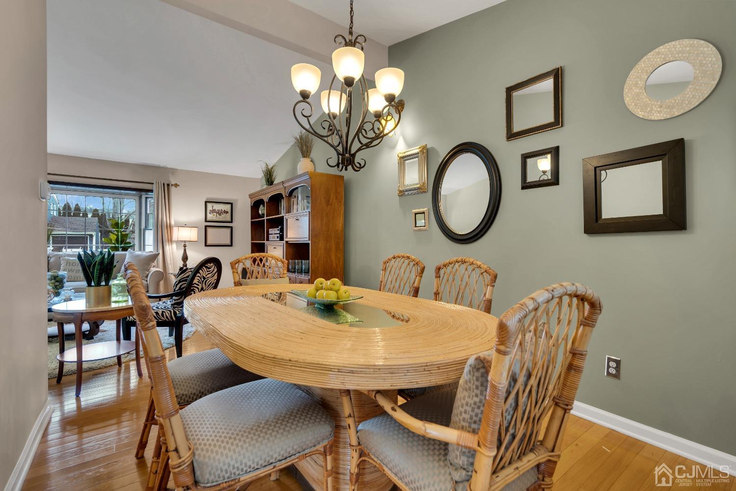 19 Calvin Court Old Bridge, NJ 08857 - Photo 11 of 25 a dining room with furniture a chandelier and wooden floor