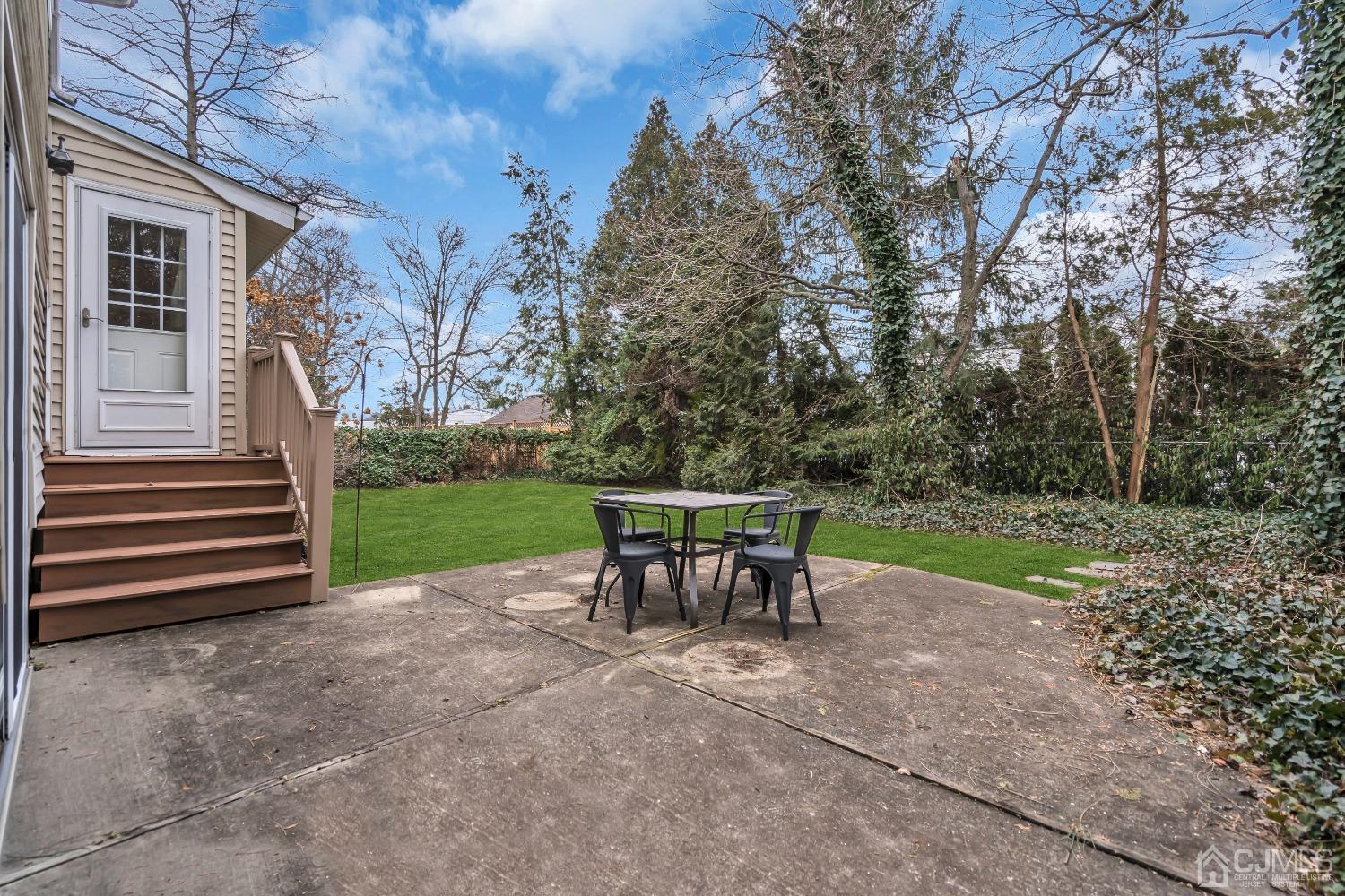 19 Calvin Court Old Bridge, NJ 08857 - Photo 23 of 25 a view of a table and chairs in the garden