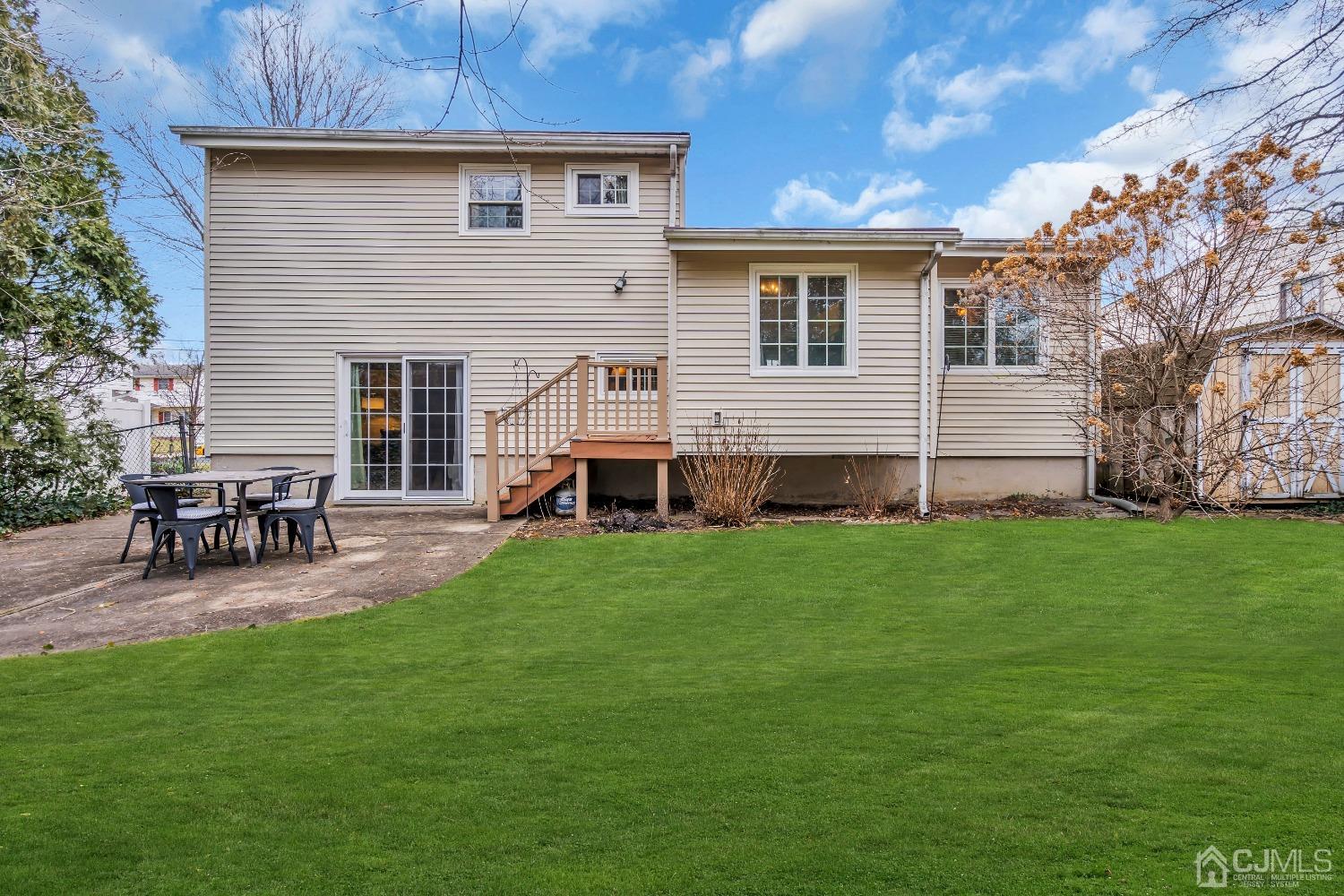 19 Calvin Court Old Bridge, NJ 08857 - Photo 24 of 25 a view of a backyard with a garden and chairs