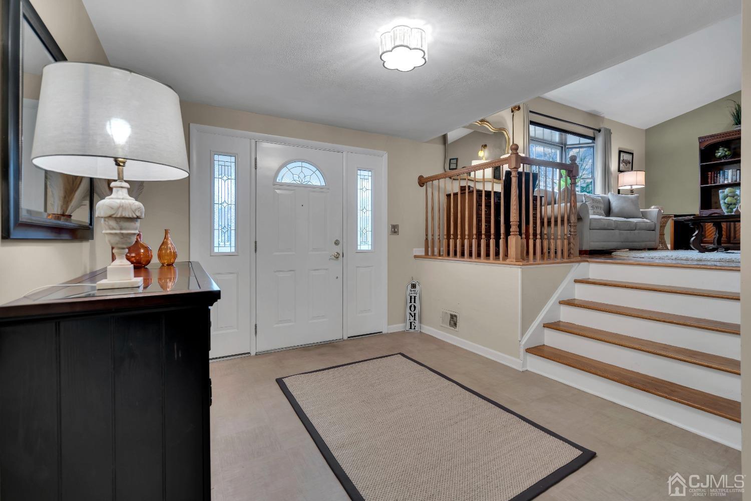 19 Calvin Court Old Bridge, NJ 08857 - Photo 3 of 25 a living room with furniture and wooden floor